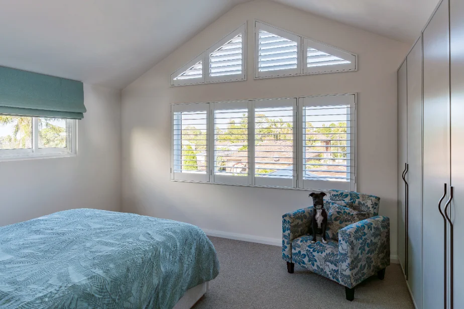 Bedroom lit through a row of CityView windows