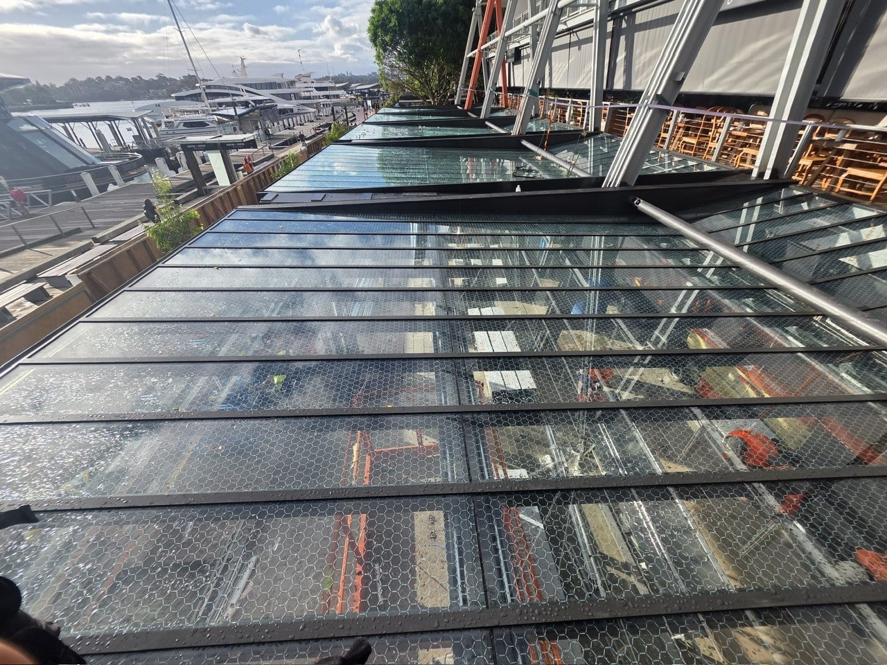 Glass awnings with aluminium capping along the King Street Wharf promenade